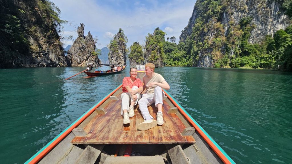 Tourists near the three Islets at the Cheow Lan Lake in Khao Sok.