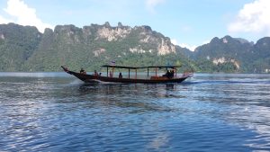 Tourist boat crossing the Cheow Lan Lake in Khao Sok.