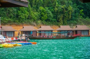 Kayaks and foating houses in the Cheow Lan Lake, Khao Sok National Park.