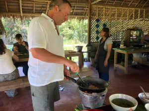 Foreigners cooking at a Thai cooking in Khao Sok.