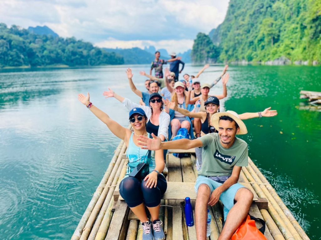 Tourists performing Banboo rafting on the Cheow Lan lake in Khao Sok.