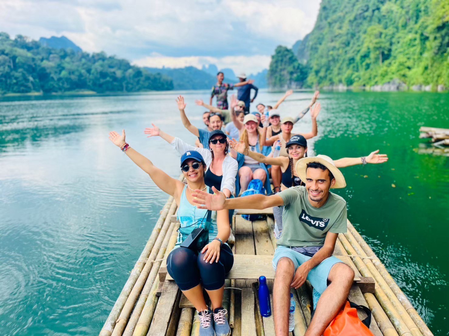 Tourists performing Banboo rafting on the Cheow Lan lake in Khao Sok.