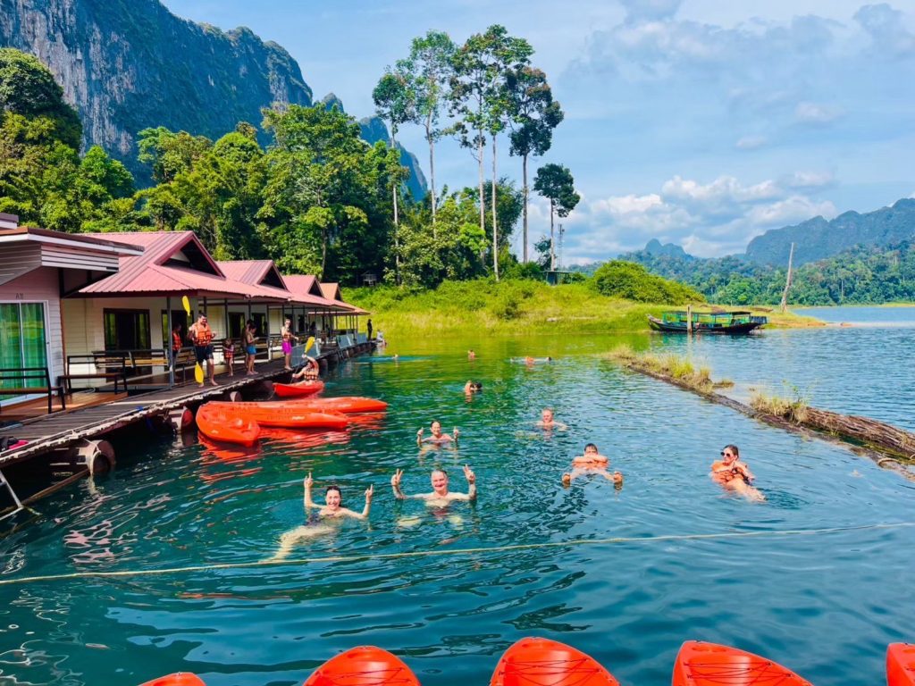 Tourists swimming in the Cheow Lan Lake in Khao Sok.