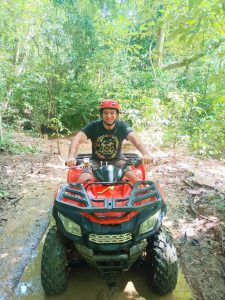 A customer rides an ATV in Khao Sok.