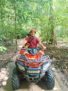 A client rides an ATV in Khao Sok.